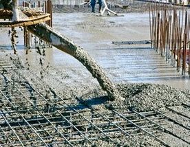 Concrete pouring during commercial concreting floors of buildings in construction